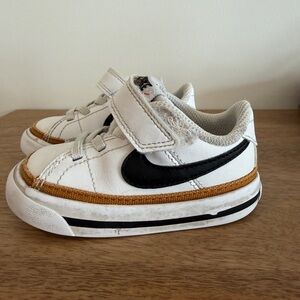 Nike Kids White and Black Sneakers with Gold Accents